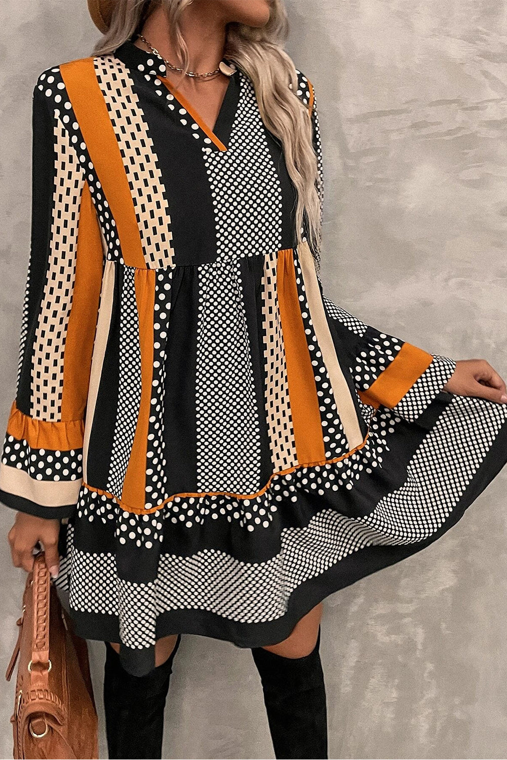 Woman wearing Black Striped Polka Dot Print Ruffled Hem V Neck Mini Dress with long sleeves